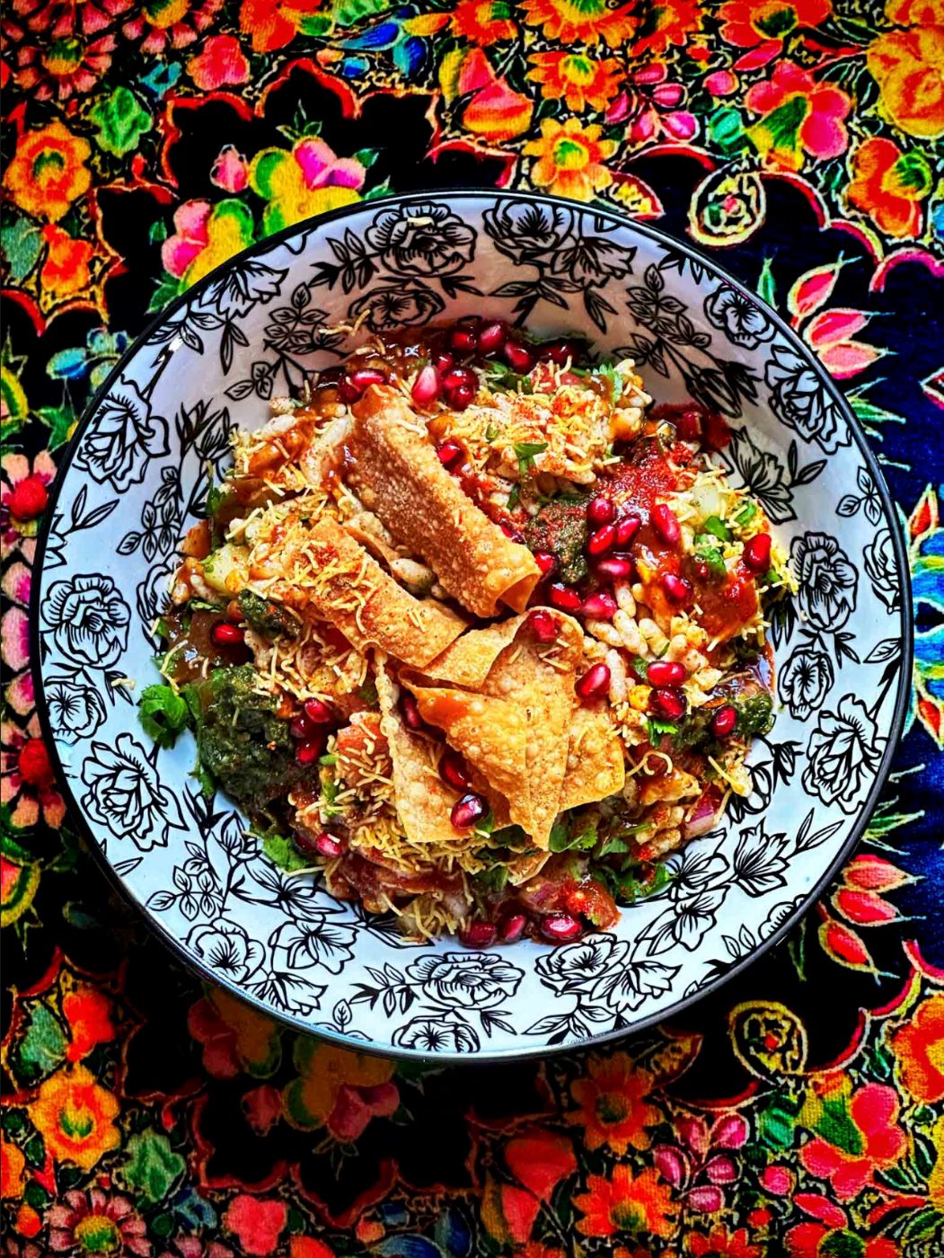 Chaat plated and dressed with edible flowers for an event